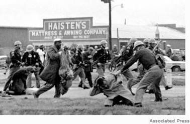 To underscore his complaints about reducing the clout of Democratic Party superdelegates, Mulholland attached to a Friday email this photo of Alabama police beating civil rights leader John Lewis in 1965 (seen on photo's right side). Lewis is now a House member from Georgia.