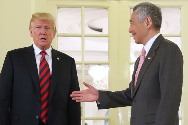 Trump with Singapore's Prime Minister Lee Hsien Loong who is hosting the summit.