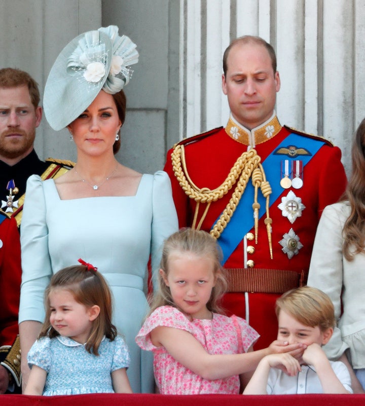 Prince William gives his son a disapproving look. 