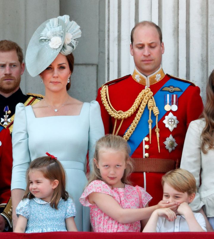 Prince William gives his son a disapproving look. 