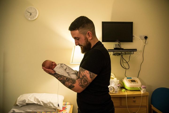 Alex Edmonds Brown holds his son Harley James in a private room in the maternity ward of the Royal Devon and Exeter Hospital in Exeter, England, on Feb. 28.