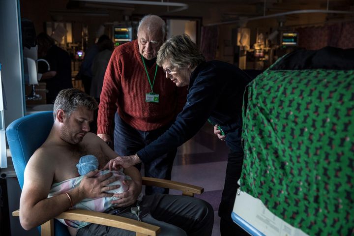 Paul Barnes does skin-to-skin contact with his son Archie, born prematurely at 33 weeks on Jan. 23 in the neonatal unit of the Royal Devon and Exeter Hospital. His parents Judy and John Barnes watch.