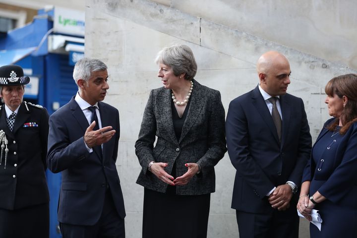 Prime Minister Theresa May, (C), Mayor of London Sadiq Khan, (L), and Home Secretary Sajid Javid