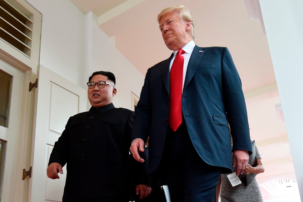 Kim walks beside Trump at the start of the summit.