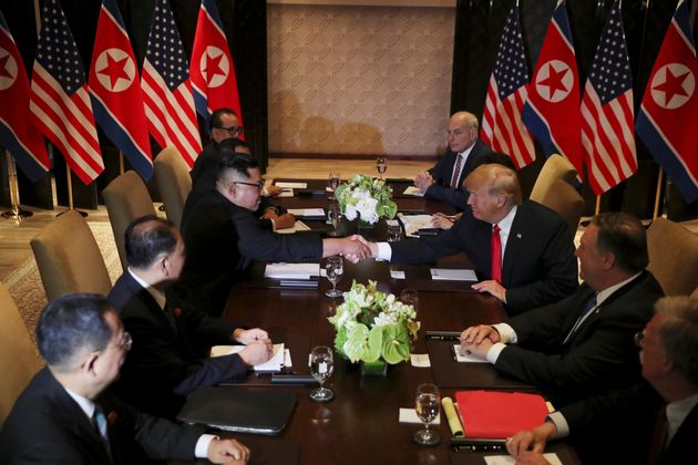 US President Donald Trump shakes hands with North Korea's leader Kim Jong Un before their expanded bilateral meeting at the Capella Hotel on Sentosa island in Singapore.