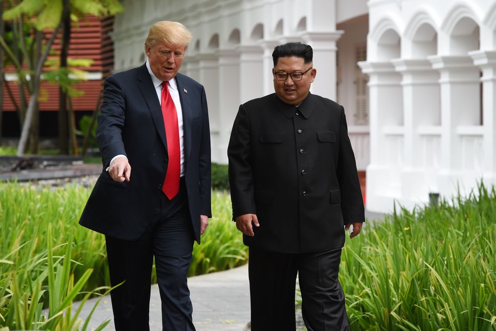 During a stroll without their interpreters, Trump resorted to pointing out foliage to the North Korean leader 