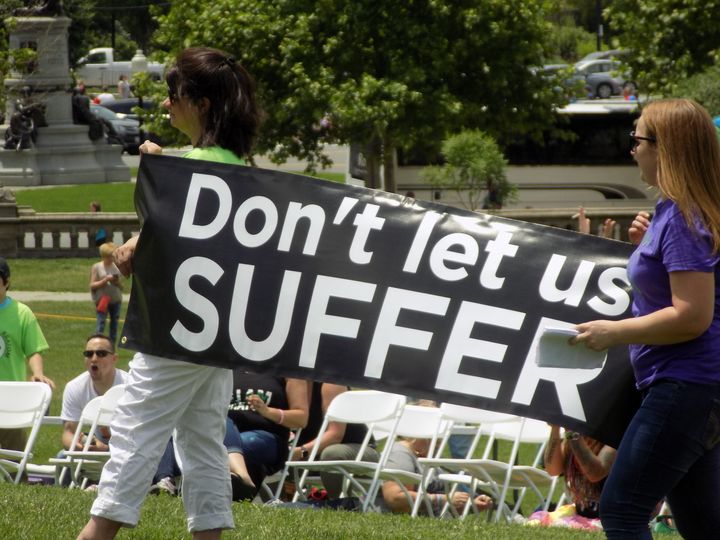 Kratom advocates hold up a sign at a rally outside the U.S. Capitol building last week.