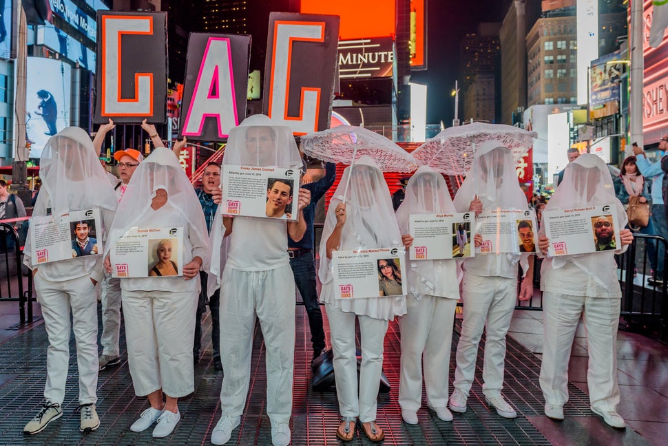At the Gays Against Guns demonstration in New York after the Las Vegas massacre, shrouded participants carried phot