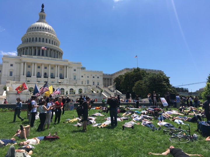 Demonstrators take part in a National Die-In demonstration in Washington on June 12, lying quietly for 720 seconds