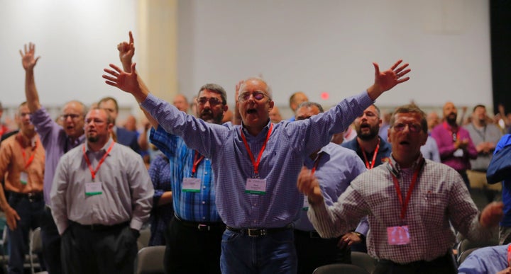 Messengers at the Southern Baptist Convention meeting in Dallas sing after a sermon by current President Steve Gaines on Tues