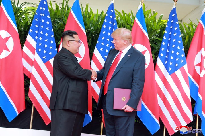 U.S. President Donald Trump shakes hands with North Korean leader Kim Jong Un at the Capella Hotel on Sentosa island in Singapore on Tuesday.