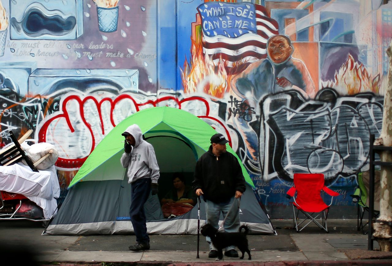 People wake up on Skid Row in downtown Los Angeles. The city is grappling with a serious homelessness problem.