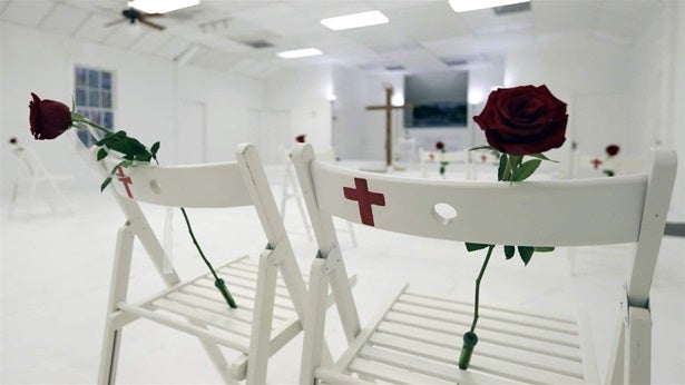 A memorial for the victims of the shooting at Sutherland Springs First Baptist Church, including 26 white chairs each painted