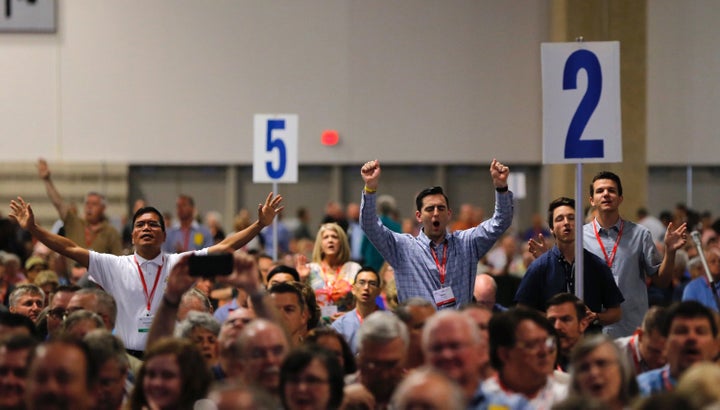 Messengers pray and worship on Tuesday, June 12, 2018, at the 2018 annual meeting of the Southern Baptist Convention in Dalla