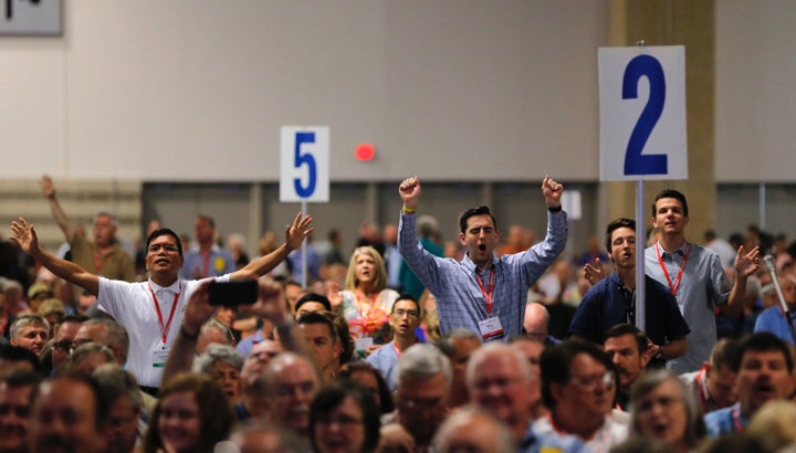 Messengers pray and worship on Tuesday, June 12, 2018, at the 2018 annual meeting of the Southern Baptist Convention in Dallas, Texas.