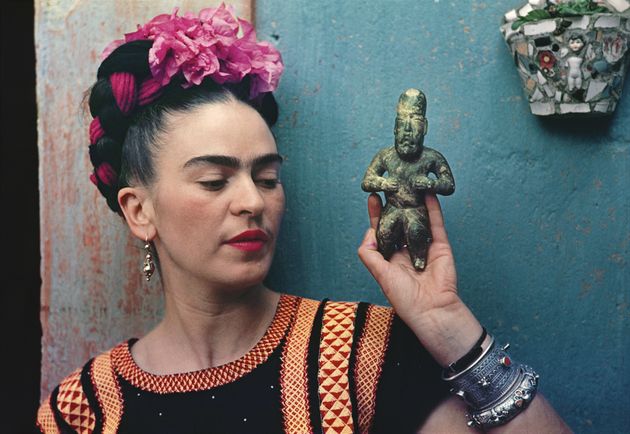 Frida Kahlo with Olmec figurine, 1939. 