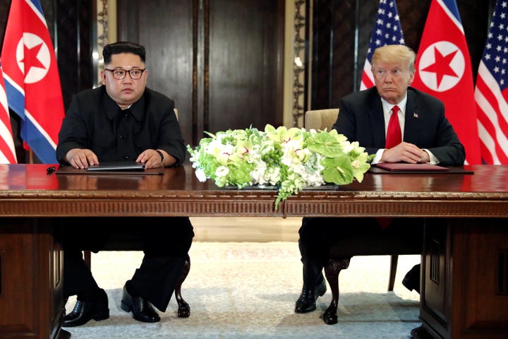 President Donald Trump and North Korean leader Kim Jong Un hold a signing ceremony at the conclusion of their summit in Singa