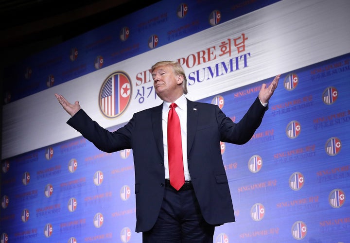 President Donald Trump departs a press conference following his meeting with North Korean leader Kim Jong Un earlier thi