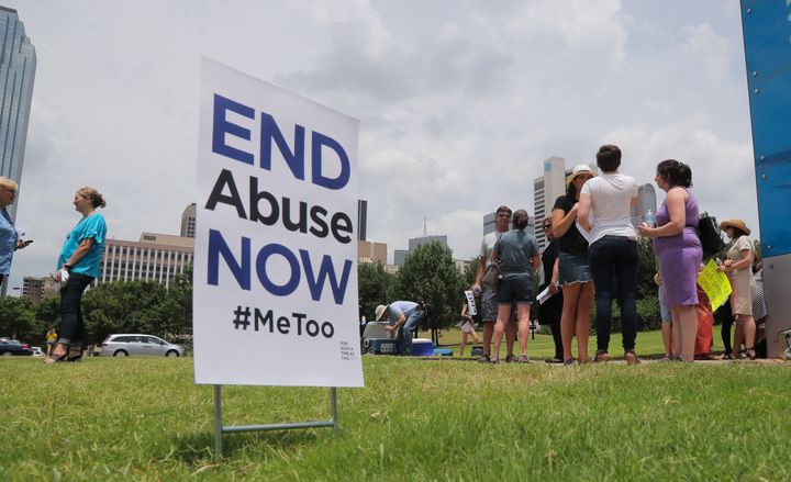 A small group of protesters fighting various forms of abuse within the church engage passersby outside at the Southern Baptist Convention meeting on Tuesday, June 12, 2018 in Dallas, Texas. 