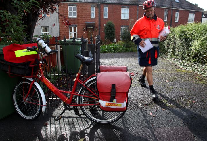 Postman Gerry Cryer delivering the post in Bristol.