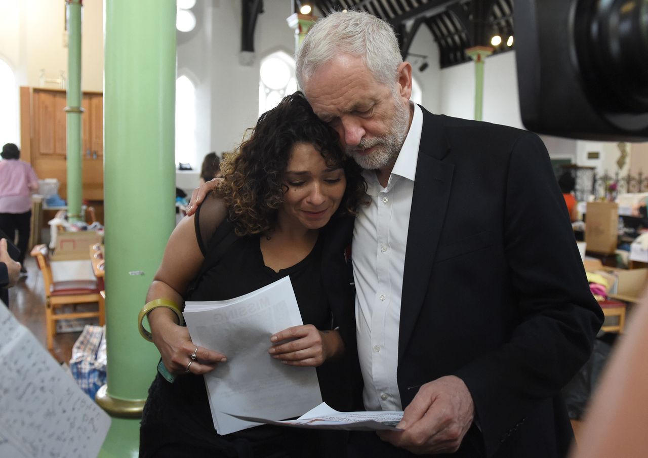 Jeremy Corbyn comforts a local resident