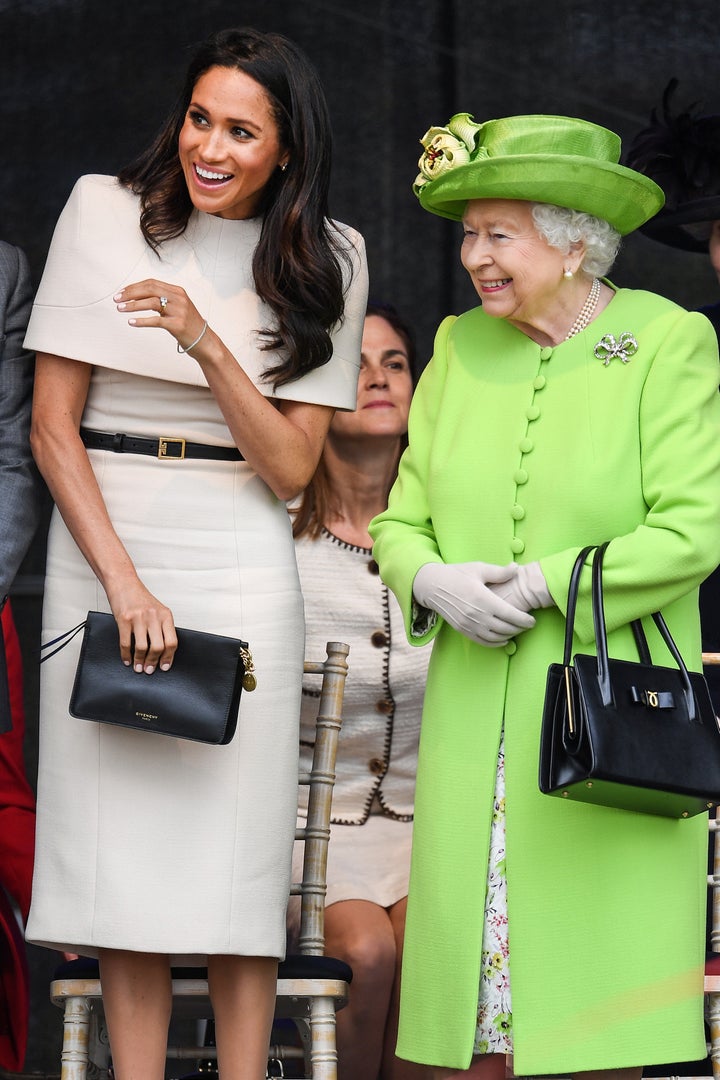 Queen Elizabeth II and Meghan, Duchess of Sussex, during a visit to the Catalyst Museum in Widnes, England, on June 14, 2018. 