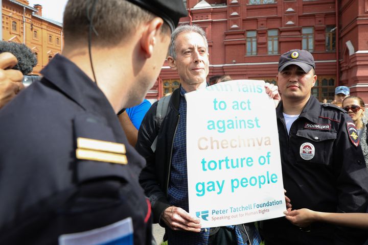 Tatchell is questioned and led away by Russian authorities in Moscow 