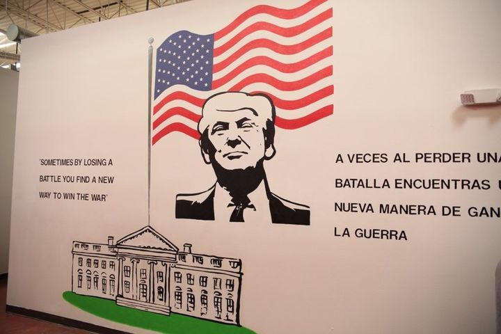 At a facility in Texas holding more than 1,400 immigrant children, a mural of Trump stares them in the face. His featured quote, "Sometimes by losing a battle you find a new way to win the war," is from his book "Art of the Deal" and is in reference to his failed attempt to evict tenants from their homes in 1985.