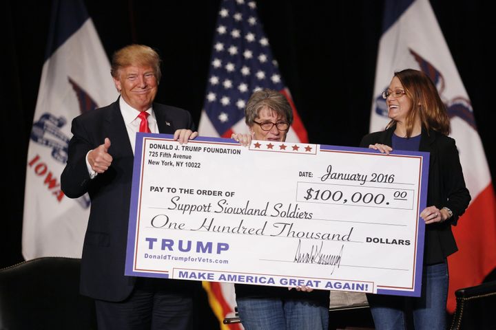 Then-presidential candidate Donald Trump awards a $100,000 check to a veterans charity during a campaign event in Sioux City, Iowa, in January 2016.