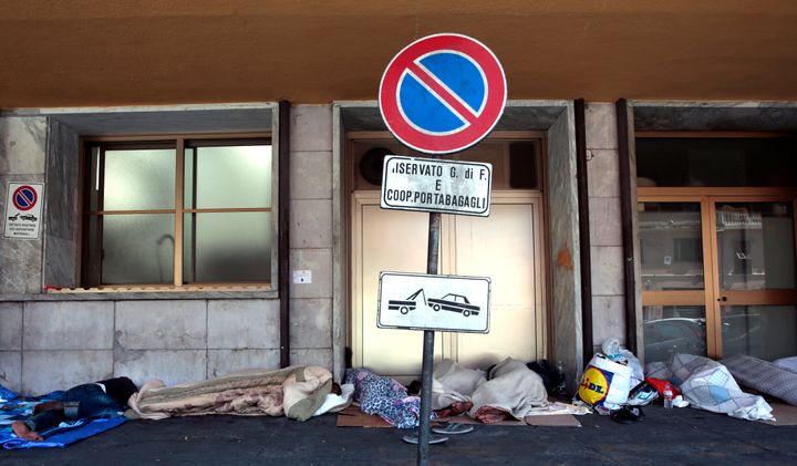 Migrants rest outside Ventimiglia railway station near the Italian-French border.