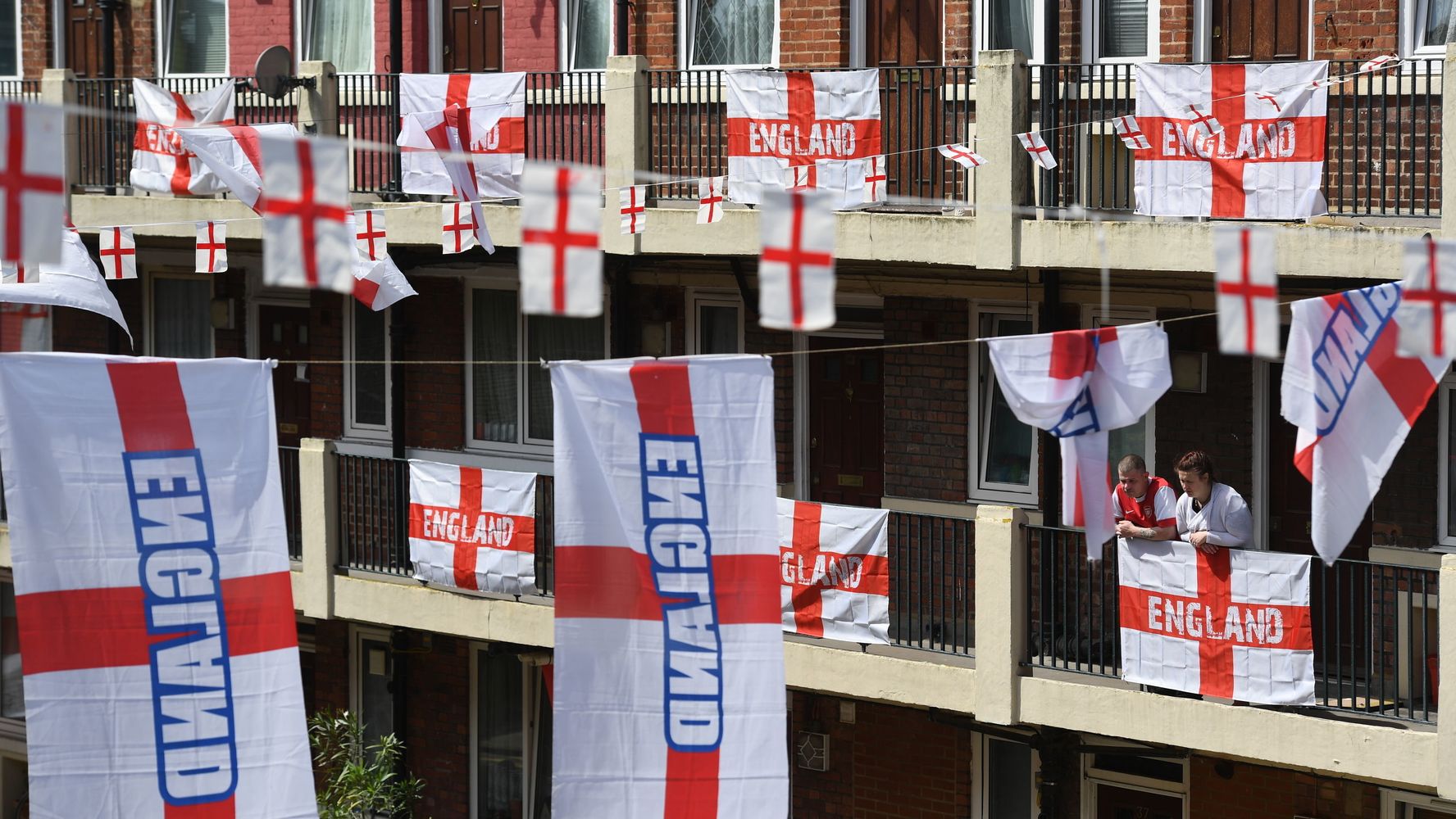 Busy London Street with American Football Banners and Flags