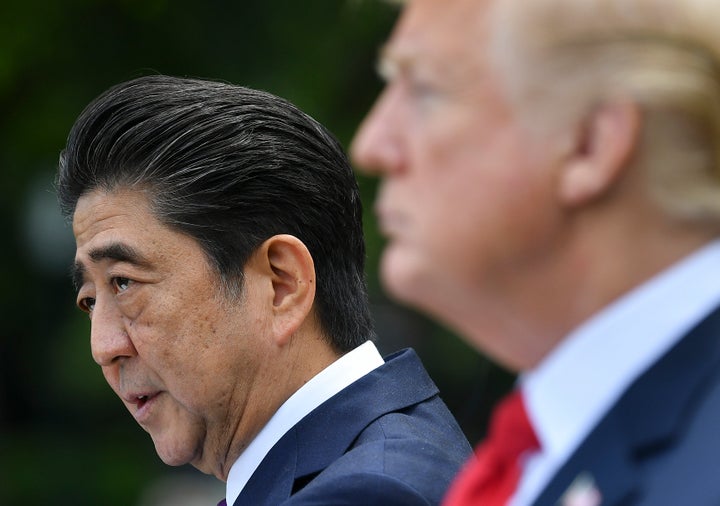 President Donald Trump looks on as Japanese Prime Minister Shinzo Abe speaks during a joint press conference in the Rose Garden of the White House on June 7.