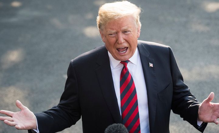 President Donald Trump stops to speak with reporters before departing for the G-7 summit on June 8. One week later, he was again confronted with reporters' questions on a variety of topics.