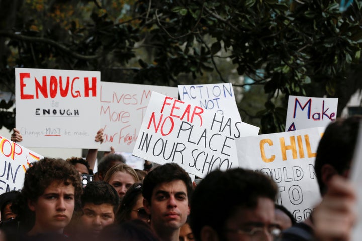 Protesters rally outside the Florida Capitol on Feb. 21 to urge state lawmakers to reform gun laws a week after a mass s