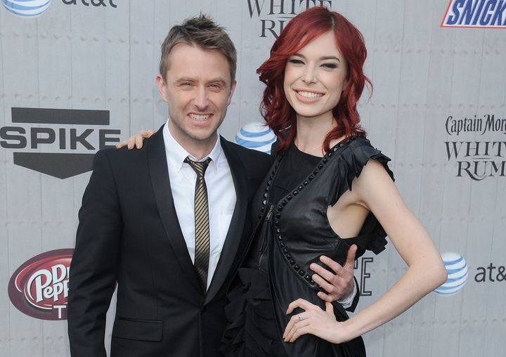 Chris Hardwick and Chloe Dykstra appear together in 2014. According to Dykstra, Hardwick would "scream" at her for something as small as "gasp[ing] at a cute puppy" and startling him.