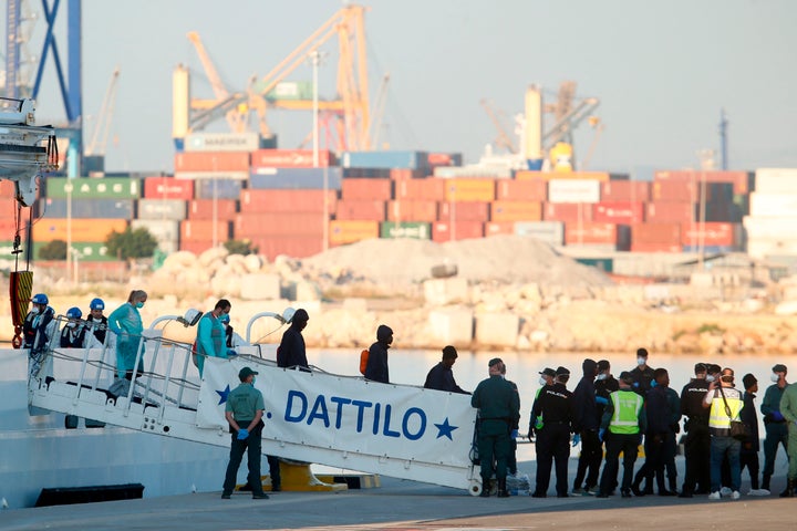 <strong>Migrants disembark from the Italian coast guard boat the Dattilo at the port of Valencia on June 17.</strong>