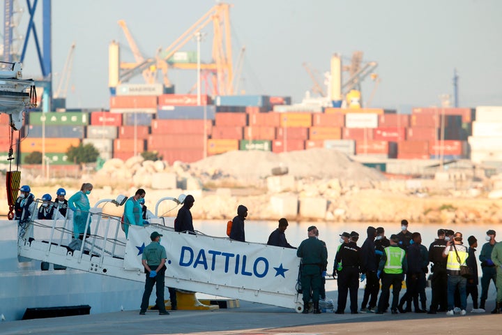 Migrants disembark from the Italian coast guard boat the Dattilo at the port of Valencia on June 17.