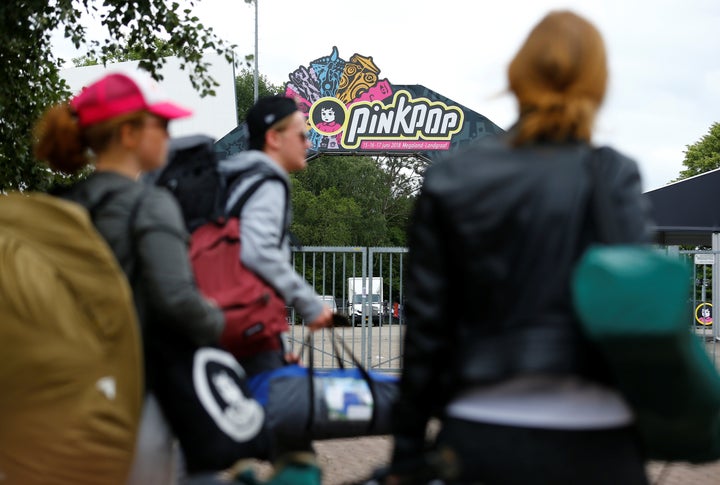 Visitors leave the grounds of the Pinkpop festival near where a van struck four people in Landgraaf, the Netherlands, on June