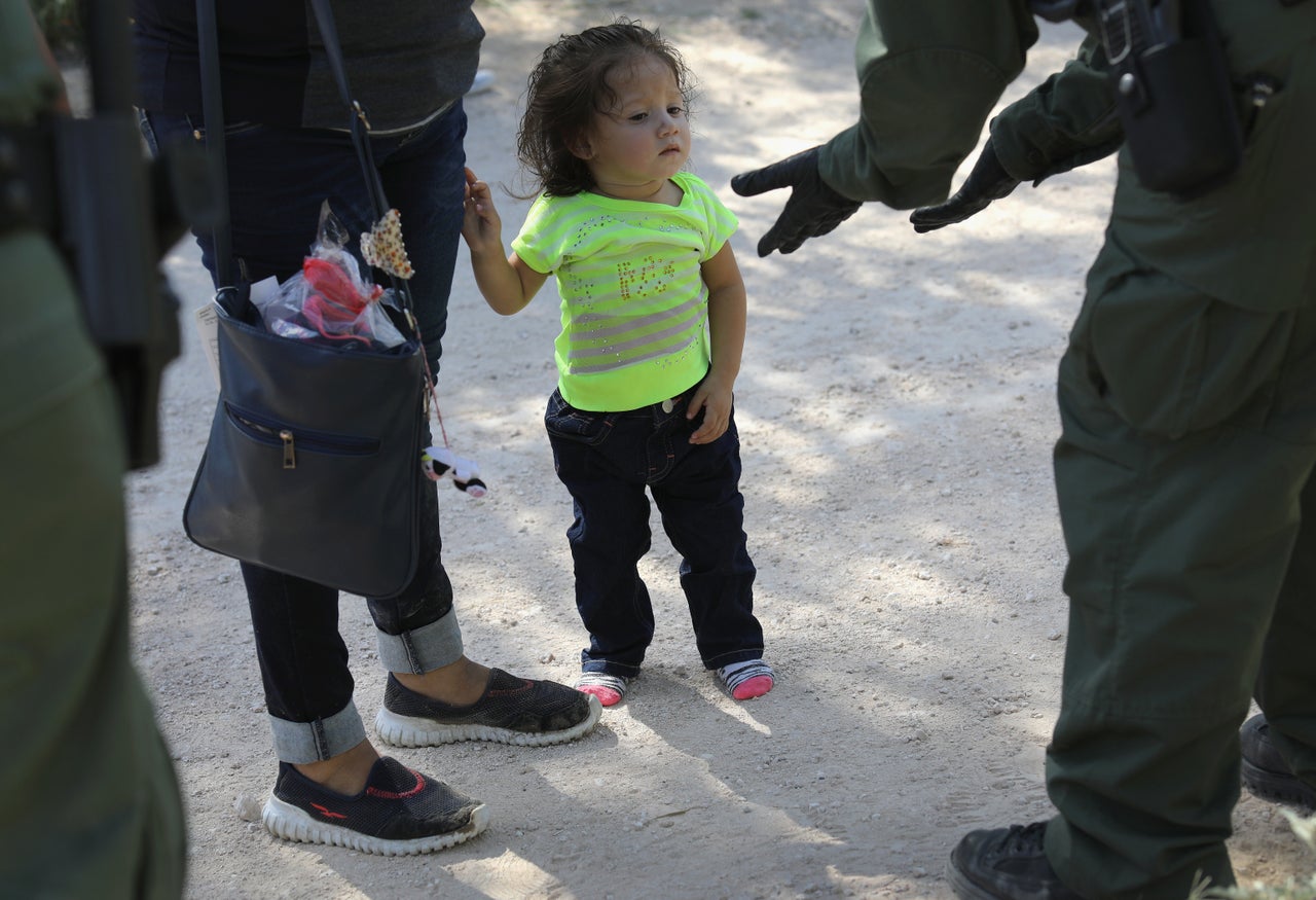 U.S. Border Patrol agents take Central American asylum seekers into custody on June 12, 2018, near McAllen, Texas.