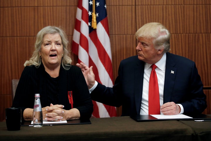 Juanita Broaddrick, who says that Bill Clinton raped her in 1975, sits with then-presidential candidate Donald Trump at a news conference on Oct. 9, 2016, shortly before his presidential debate with Hillary Clinton.