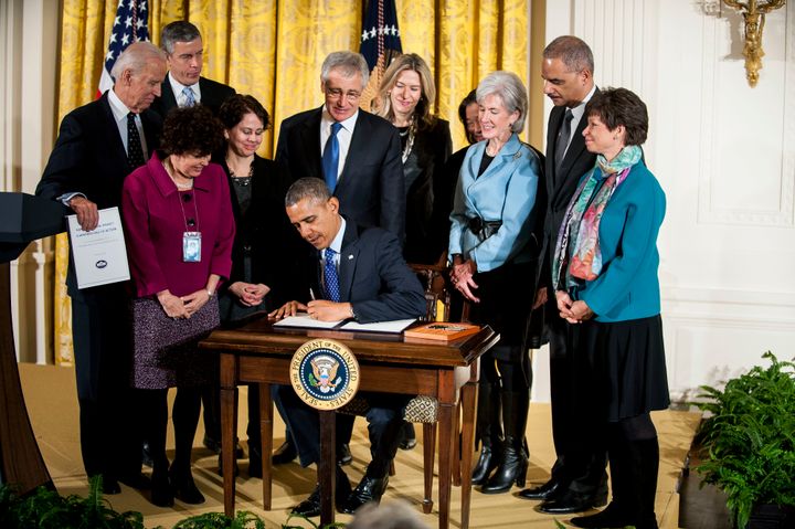 President Barack Obama signs a 2014 memorandum establishing a task force to protect students from campus sexual violence. 
