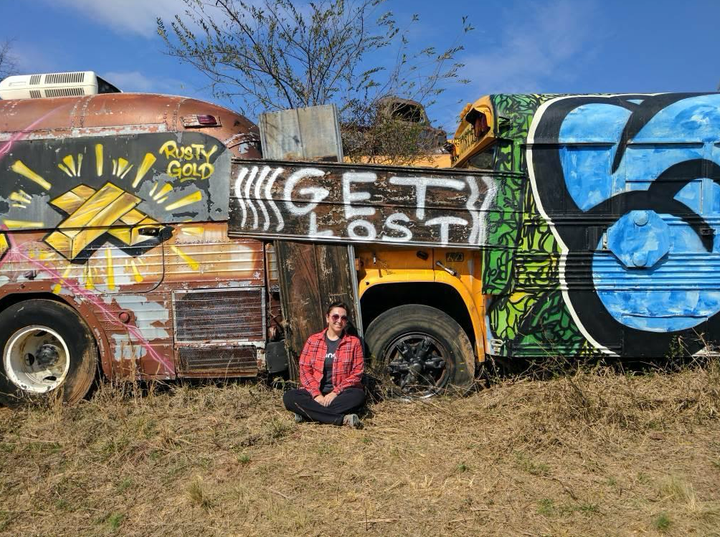 Hailey sitting in the school bus graveyard in Alto, Georgia.