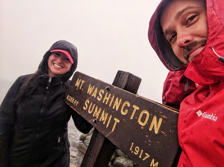 Hailey and Mitch on the summit of Mount Washington in the White Mountains of New Hampshire.