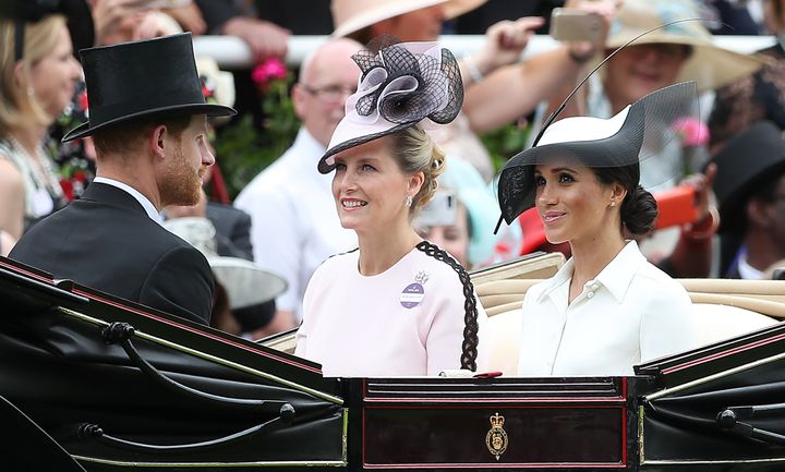The Duke and Duchess of Sussex arrive alongside Sophie, Countess of Wessex. 