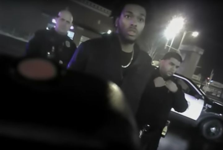 Sterling Brown is seen in handcuffs after detained by police for parking his car across two handicapped parking spots.
