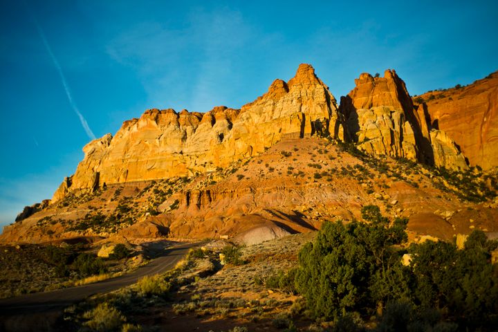 Morning Sunlight illuminating the Circle Cliffs. The Colt Mesa deposit, discovered in 1969, is located in the Circle Cliffs area, approximately 35 miles southeast of Boulder, Utah.