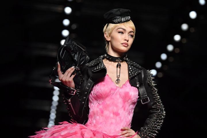 Model Gigi Hadid wears feathers at a Moschino runway show in September 2017.