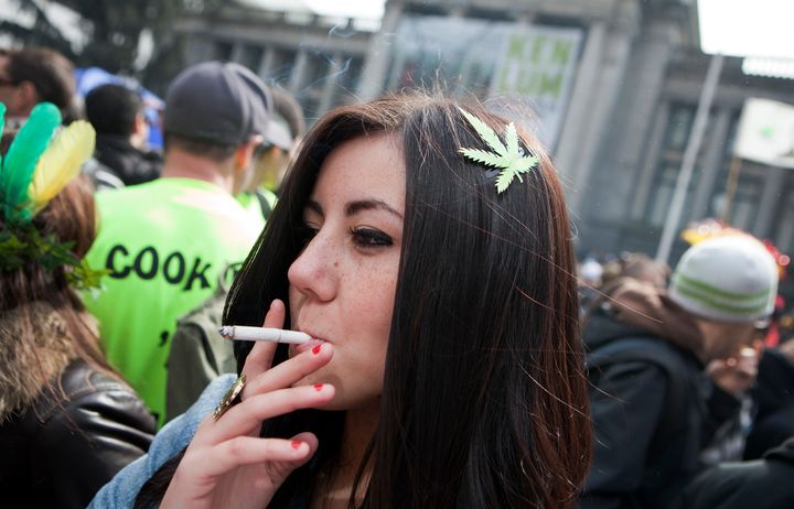 Canada is to legalise cannabis nationwide; a woman is pictured above smoking a joint at the annual 420 cannabis rally in Vancouver 