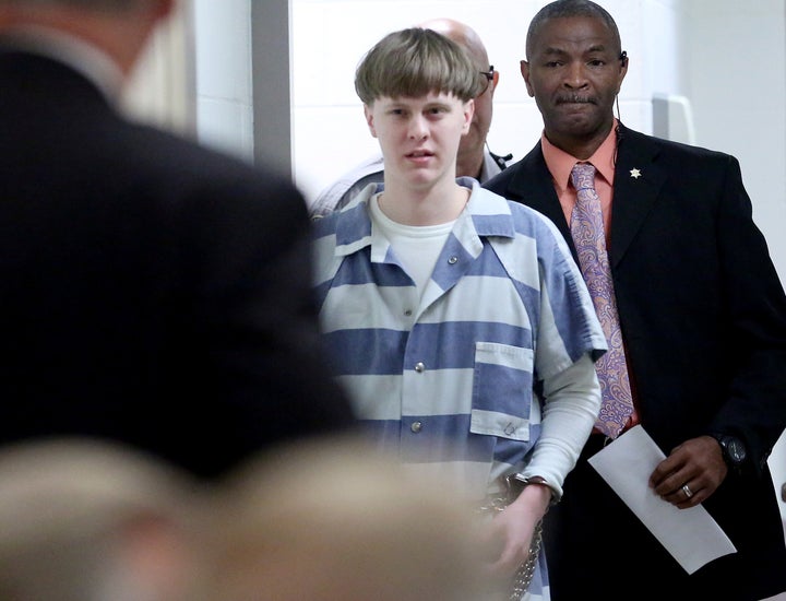 U.S. District Judge Richard Gergel criticized what he called “abysmally poor” FBI policies for the system that allowed Dylann Roof, center, to buy the gun he used to kill nine people, all African-Americans, at a historic black church in Charleston.