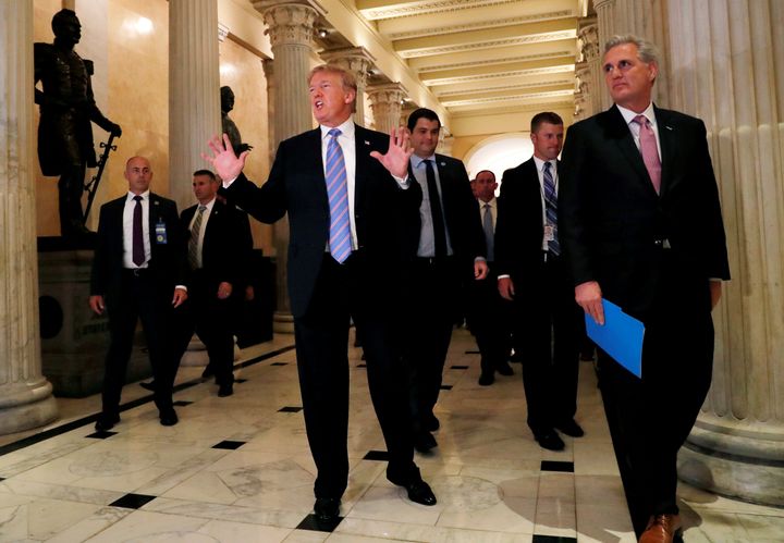 US President Donald Trump speaks briefly to reporters after leaving a closed House Republican Conference meeting in Washington on Tuesday